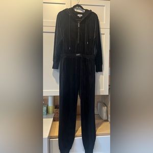 Calvin Klein black velvet jumpsuit in size medium. Worn one time only.